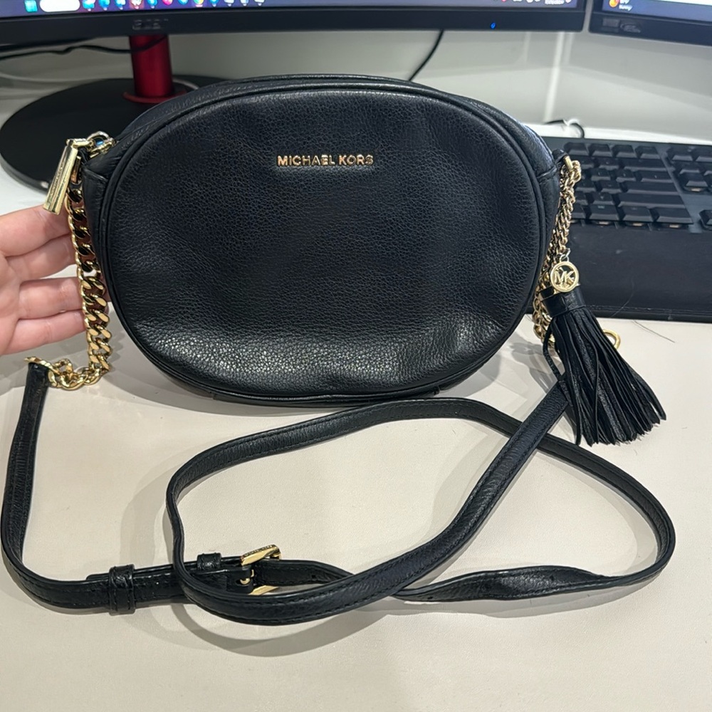Michael Kors leather crossbody clutch bag in black and gold chain